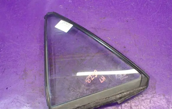 Mazda 323 Front door window glass four-door