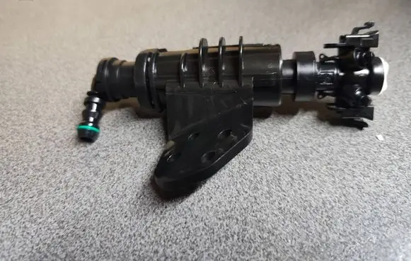 Hyundai Tucson TL Headlight washer spray nozzle 986712W000