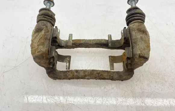 Subaru Forester SG Brake caliper pad carrier rear 