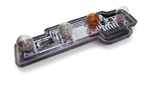 Tail light bulb cover holder