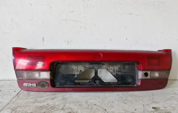 Mazda 626 Trunk door license plate light bar 0431394