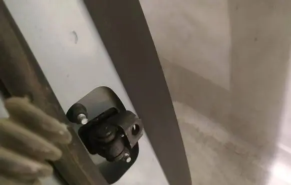 Rear door check strap stopper