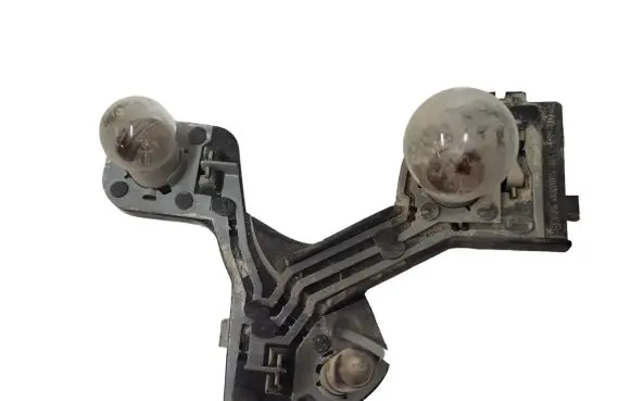 Tail light bulb cover holder