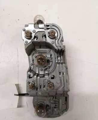 Tail light bulb cover holder