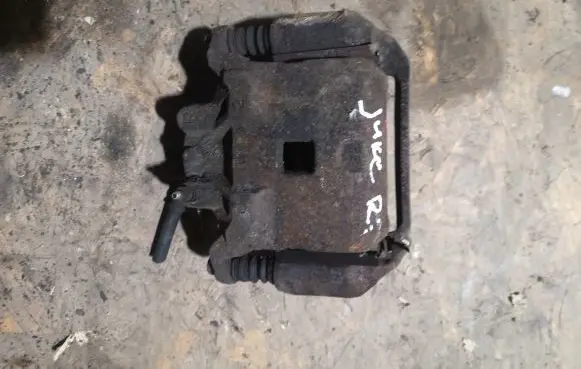 Nissan Juke I F15 Front brake caliper