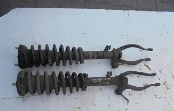 Renault Megane III Front shock absorber with coil spring MCPERSON