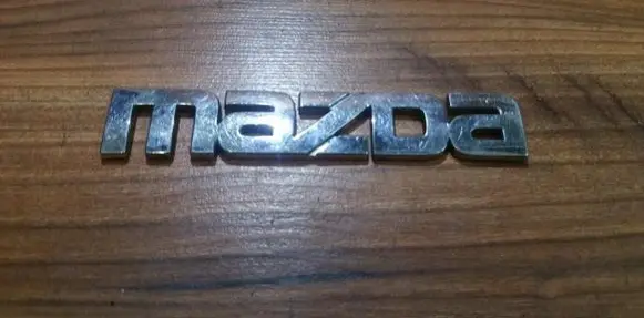 Mazda 323 Manufacturer badge logo/emblem 