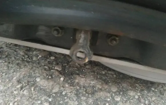 Front door check strap stopper