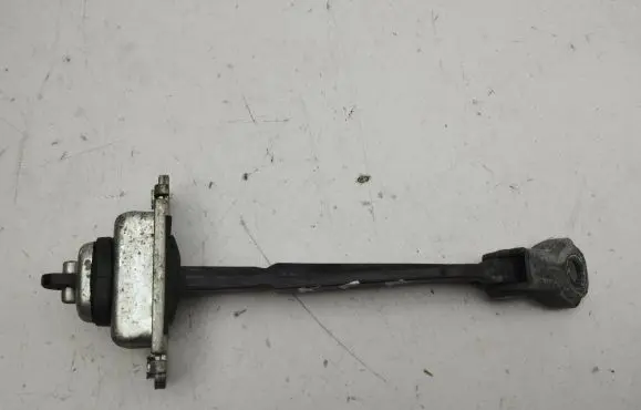 Front door check strap stopper