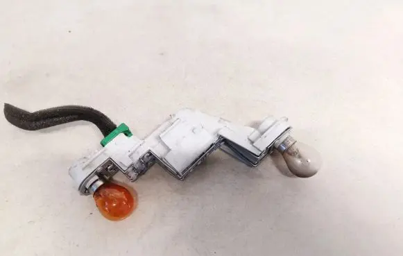 Volvo V50 Tail light bulb cover holder