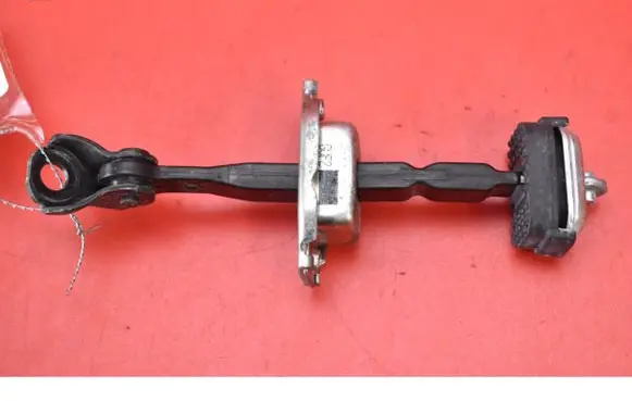 Front door check strap stopper