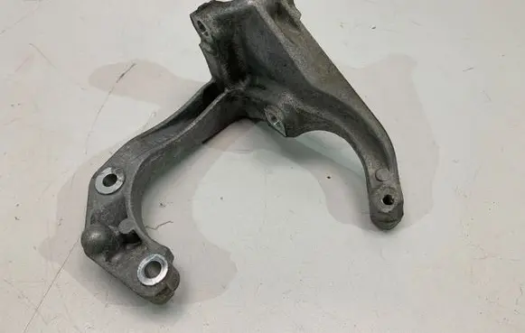 Audi A5 A/C compressor mount bracket 06M260885M