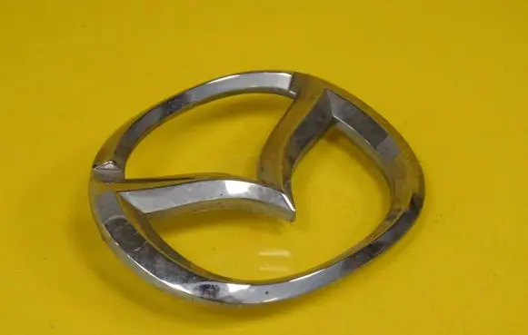 Mazda 323 Manufacturer badge logo/emblem 