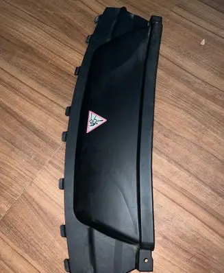 Engine bonnet/hood lock trim molding