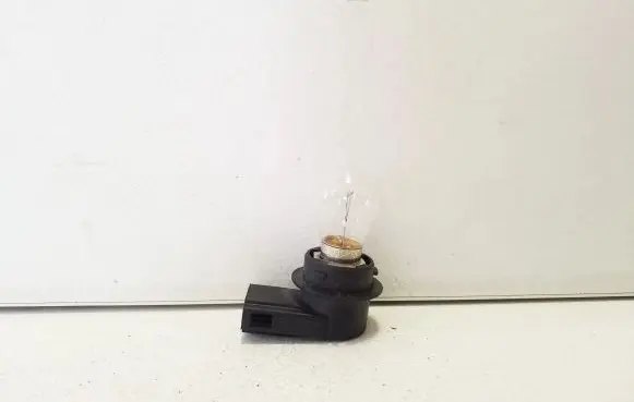 Tail light bulb cover holder