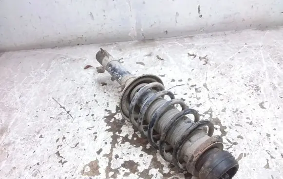 Volkswagen Golf IV Front shock absorber with coil spring 1J0413031AE