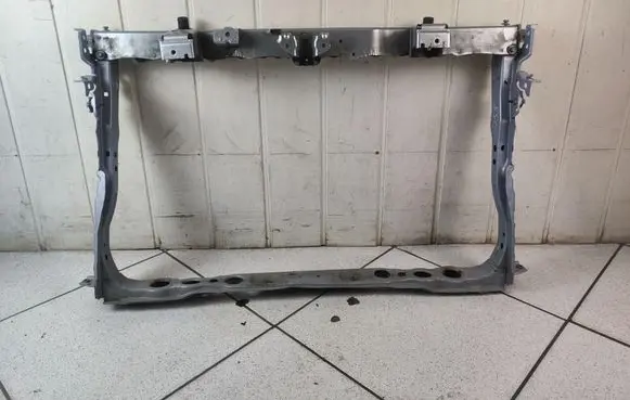 Radiator support slam panel