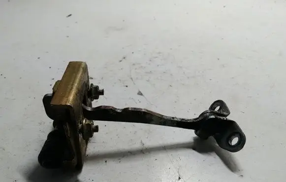 Front door check strap stopper