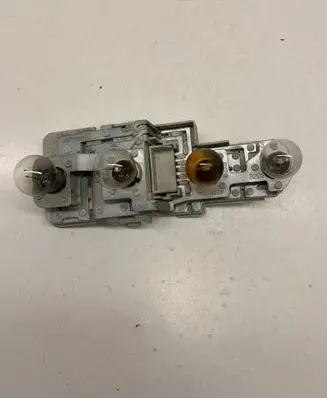 Tail light bulb cover holder