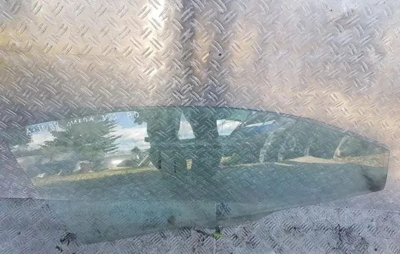 Mazda 323 Front door window glass four-door