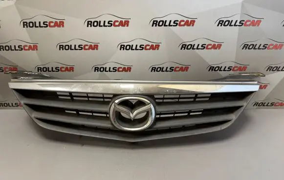 Mazda 626 Front bumper upper radiator grill GG2M50712
