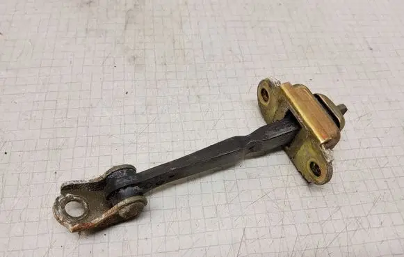 Nissan Primera Front door check strap stopper