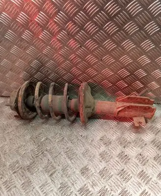 Mazda 323 F Front shock absorber with coil spring