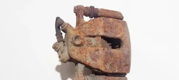 Suzuki Swift I Front brake caliper