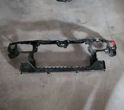 Radiator support slam panel