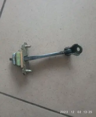 Subaru Legacy Rear door check strap stopper