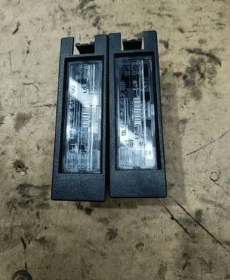 Opel Corsa D Number plate light 13251936 00319701570