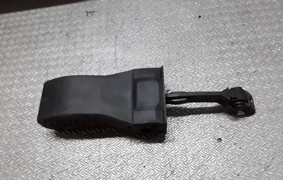 Front door check strap stopper