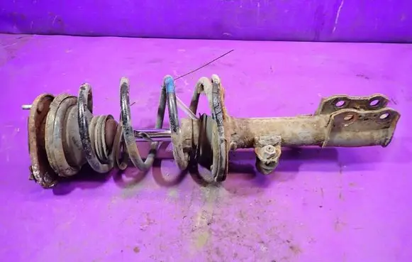 Toyota Corolla E120 E130 Front shock absorber with coil spring 