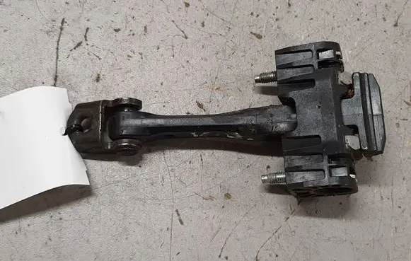 Front door check strap stopper
