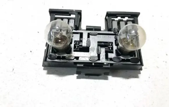 Tail light bulb cover holder