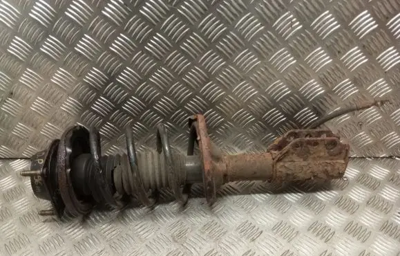 Mazda 323 F Front shock absorber with coil spring