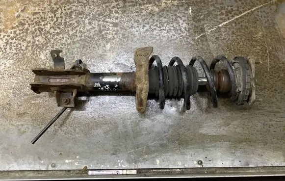Front shock absorber with coil spring
