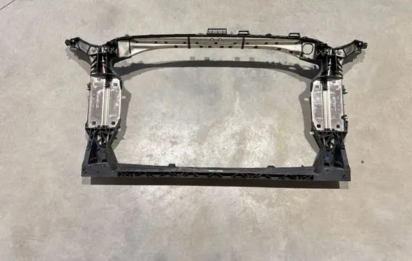 Radiator support slam panel