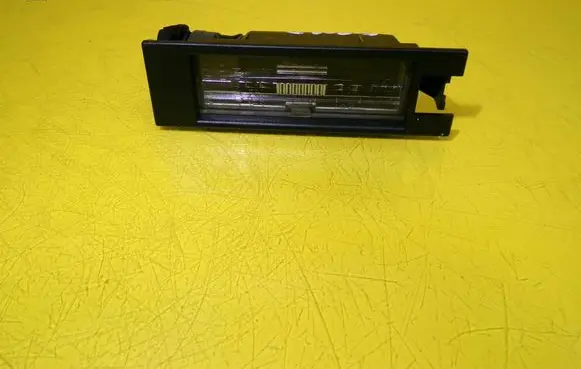 Opel Corsa D Number plate light 13139990