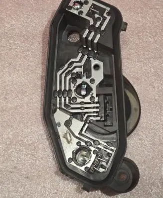 Tail light bulb cover holder