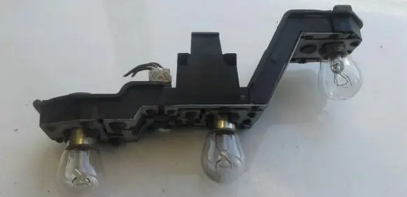 Nissan Micra Tail light bulb cover holder