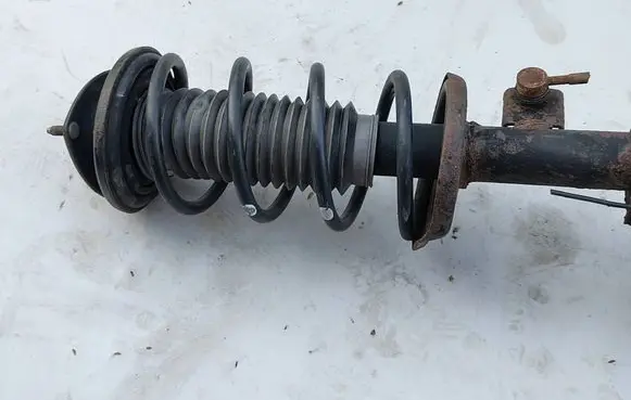 Suzuki Grand Vitara II Front shock absorber with coil spring