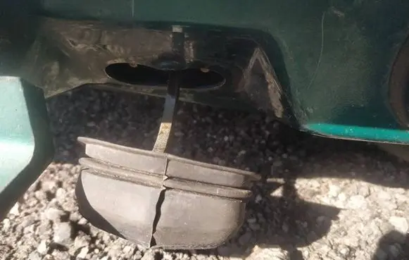 Front door check strap stopper