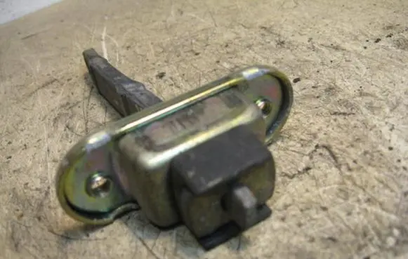 Front door check strap stopper