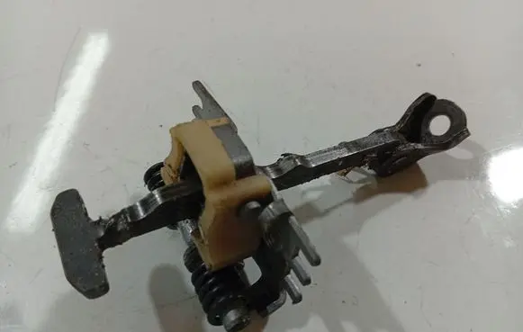 Rear door check strap stopper