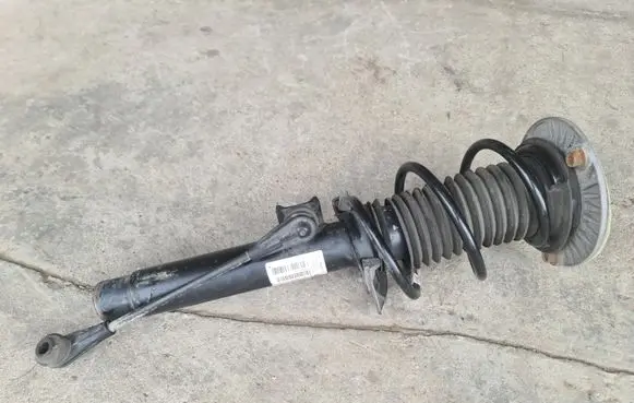 Front shock absorber with coil spring