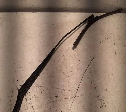 Front wiper blade arm