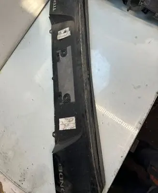 Trunk door license plate light bar