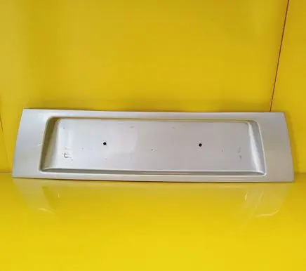 Trunk door license plate light bar