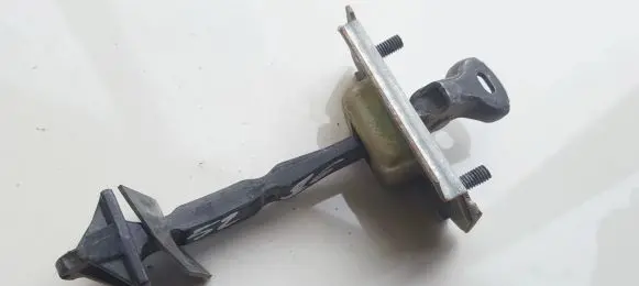 Mazda Premacy Rear door check strap stopper